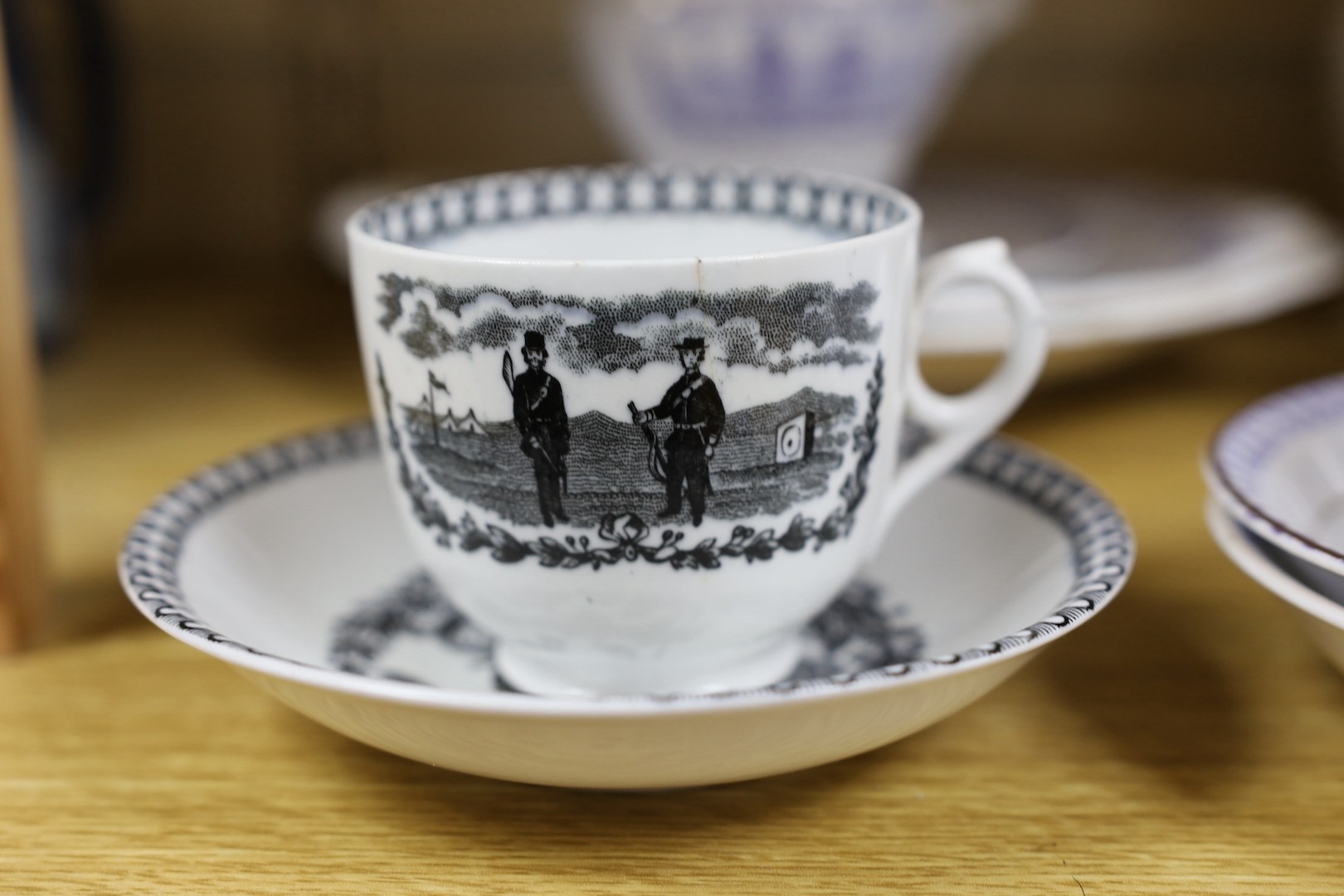 A group of mid 19th century Staffordshire British rifle volunteers and rifle target practice commemorative ceramics